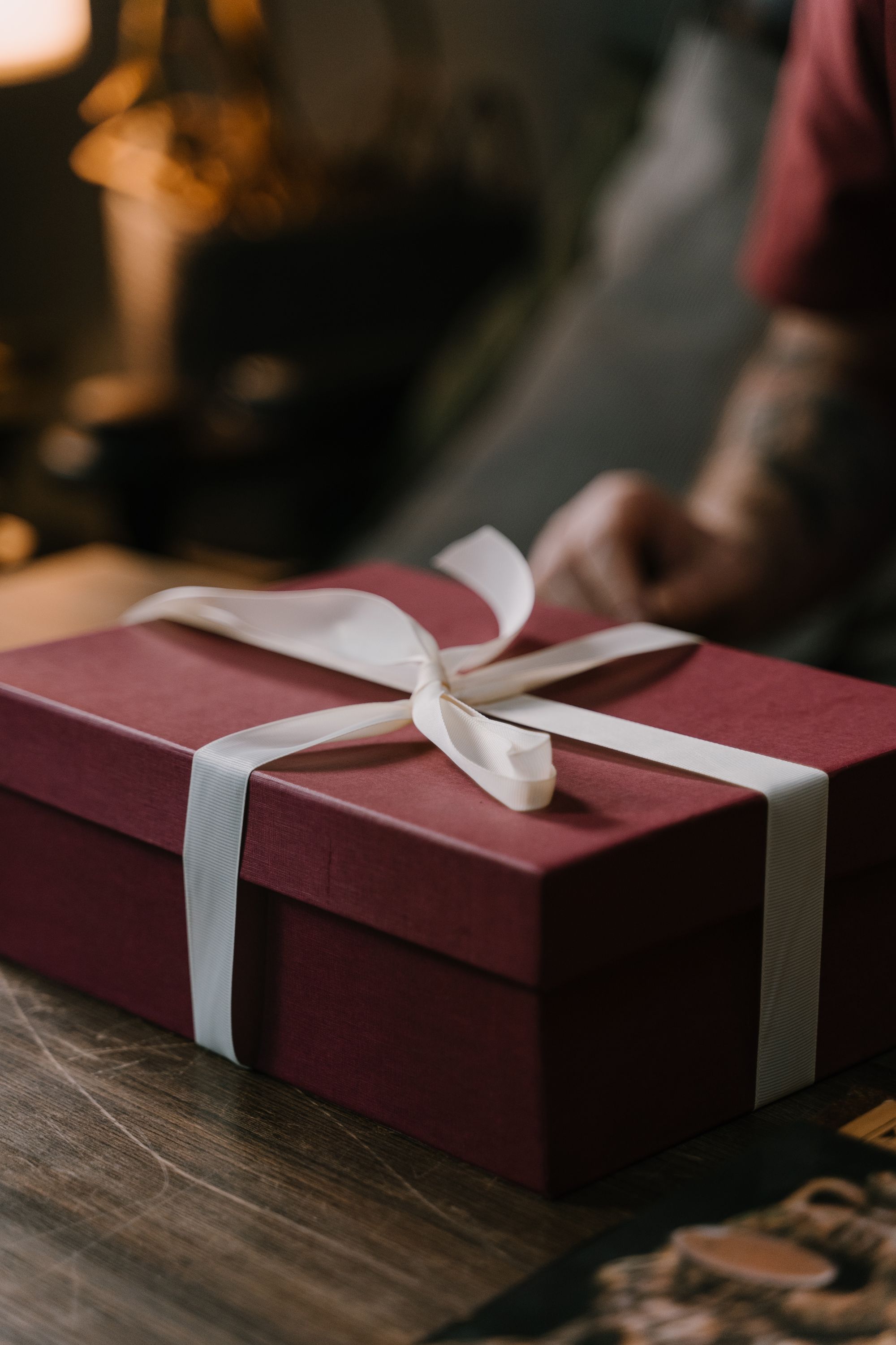 Burgundy gift box finished with a cream satin ribbon